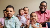 Emilio, his wife, and their four children.